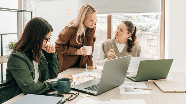 Three woman discuss the best processes for keeping their devices up to date and secure.