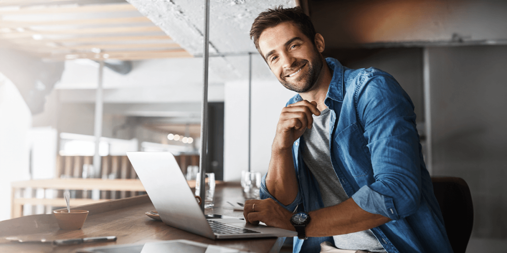 Guy looking happy at work